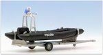 Polizei-Boot mit Motor und Aufbau auf Trailer